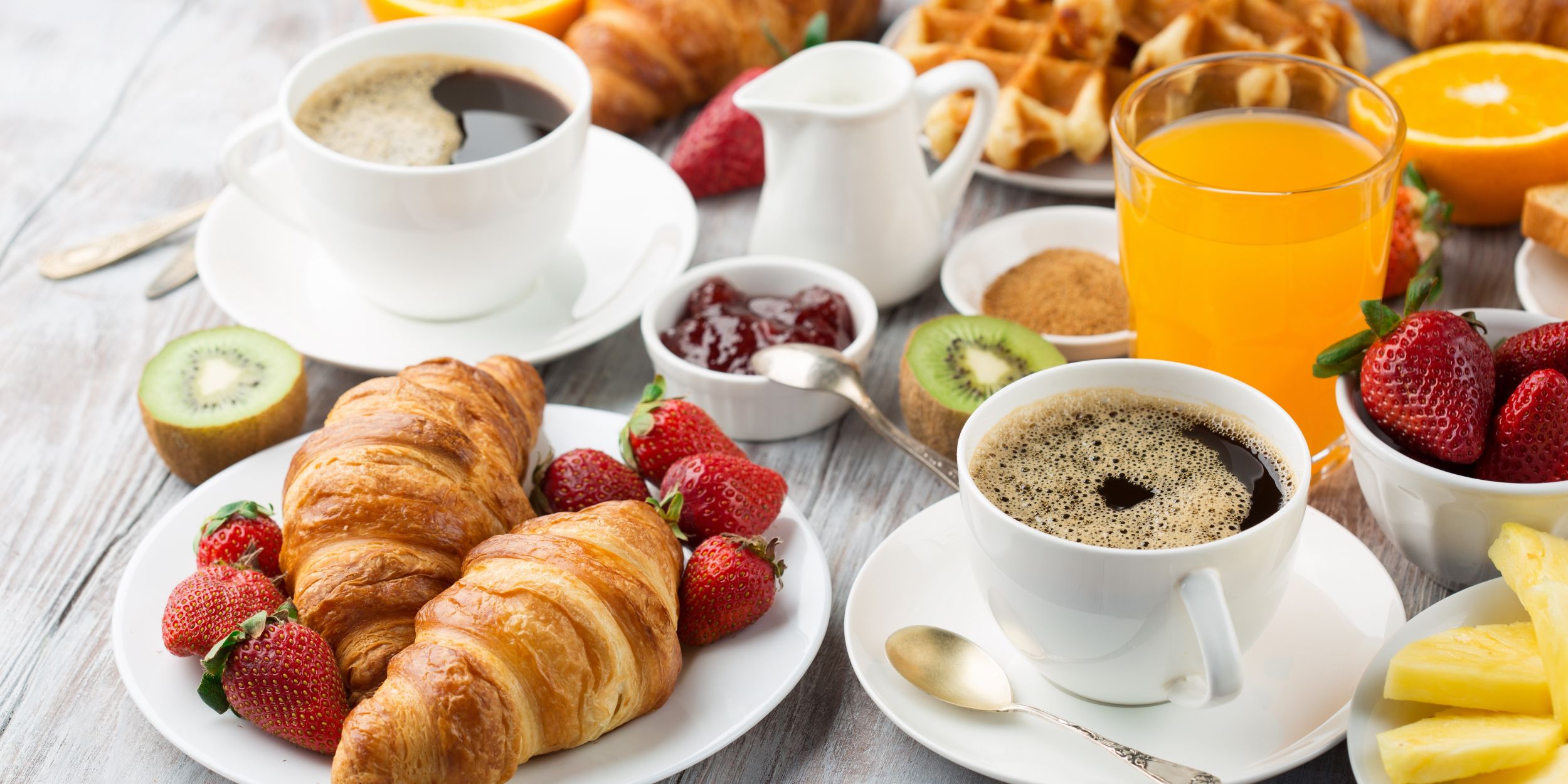 A Table With Breakfast Items